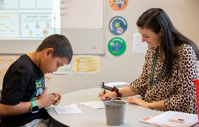 Student and teacher working together