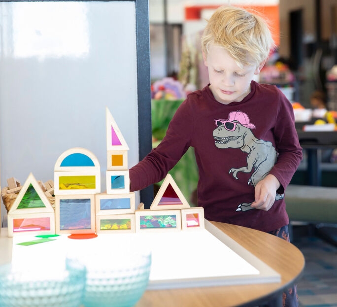 Child building a tower out of blocks